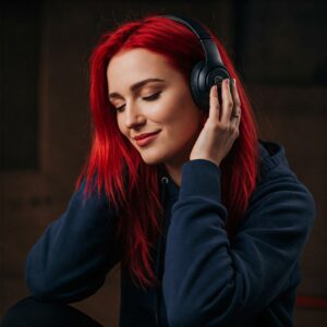 A person wearing headphones enjoying bass-heavy music.