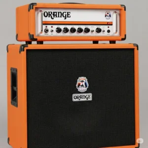 An orange bass amps head sitting atop a bass speaker cabinet, demonstrating a common setup for bass guitarists.