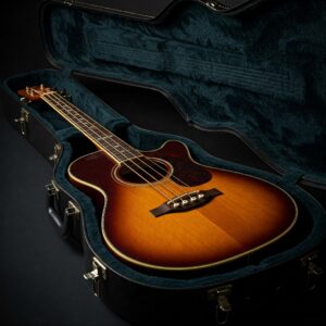 An acoustic bass guitar safely stored inside its protective case.