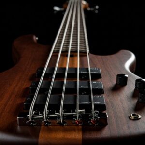 "A bass guitar strung with new and shiny elixir bass strings."