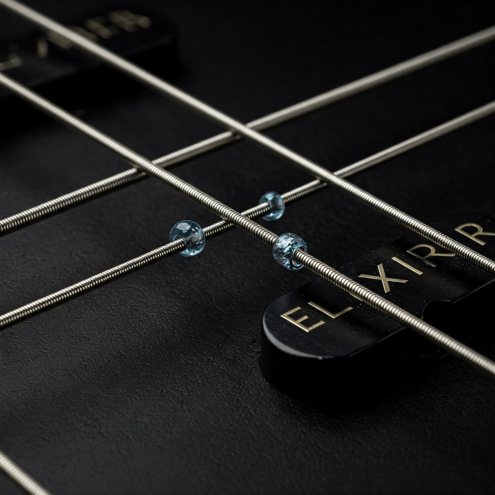 "Close-up view of elixir bass strings, showcasing their long-lasting coating."