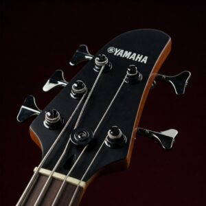 Yamaha logo on the headstock of a yamaha 5 string bass guitar.