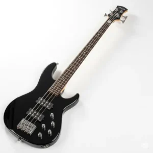 A striking, full-body view of a black Schecter Diamond Series bass, showcasing its sleek design and hardware details. This versatile instrument is a popular choice for rock and metal musicians.