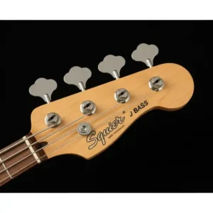 Detail of a Squier J Bass headstock with the Squier logo and tuning pegs, highlighting the instrument's authentic design.