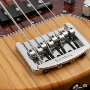 Detailed shot of the high-quality bridge and adjustable saddles on a Sandberg California electric bass, designed for optimal sustain and intonation. Essential for any sandberg bass california.