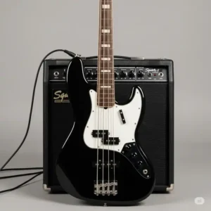 A Squier J Bass connected to a bass amplifier, showcasing a typical setup for practicing or recording with the instrument.