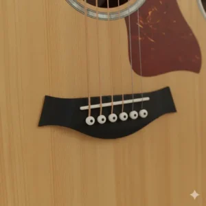 Close-up view of the bridge and saddle on a left handed acoustic electric guitar, showing the string alignment.