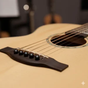 Close-up view of the unique bridge and saddle placement required for a fanned fret guitar to accommodate the varied string lengths. 