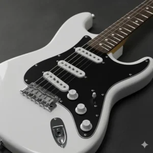Detail photo of a bright white electric guitar body with a contrasting black pickguard and bridge.