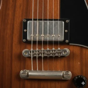 Close-up shot showing the textured chrome handle and knurling for a secure grip on professional-grade 115 lb dumbbells.