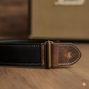 The soft black cotton backing of vintage guitar straps designed for maximum shoulder comfort during long sets.