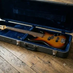 Close-up of the spacious exterior storage compartments on a soft short scale bass case holding accessories.