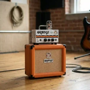 Glowing vacuum tubes inside a compact combo setup, showcasing a great option for a tube-driven best guitar amp under 500 dollars.