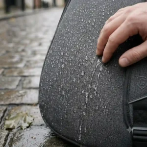 Water droplets shedding off the heavy-duty weather-resistant nylon exterior of the best bass guitar gig bag.